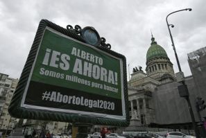 An advert asking President Alberto Fernandez to present a new bill to legalize abortion, pictured outside the Argentine Congress building in Buenos Aires, in October 2020