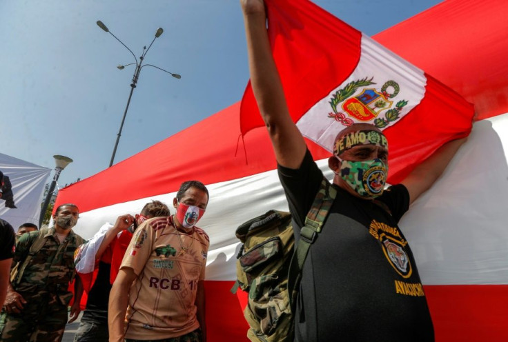 Peruvian army reservists taking part in a "rally for democracy" near the Congress building in Lima, shortly before the country's new president Francisco Sagasti was sworn in