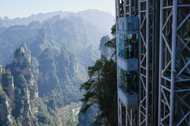 Located in China's Zhangjiajie Forest Park, the world's highest outdoor lift carries tourists up the cliff face that inspired the landscape for the movie "Avatar"