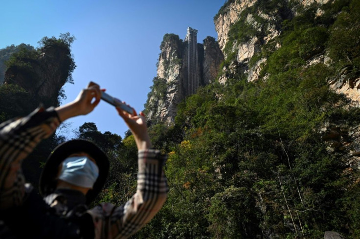 Tourists can zip up the cliff in just 88 seconds -- or brave a three hour climb to the top