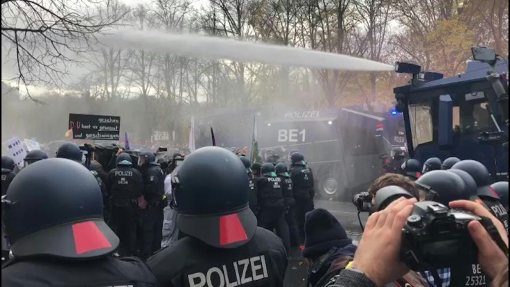 IMAGESGerman police fire water cannon to disperse thousands of unmasked protesters who had massed in central Berlin to demonstrate against government measures to curb the spread of the coronavirus.