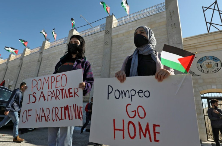 Palestinians demonstrate near the Israeli settlement of Psagot, built on the lands of the city of al-Bireh, against the visit by US Secretary of State Mike Pompeo