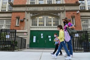Mayor Bill de Blasio said New York's 1,800 public schools would revert to remote learning after the city recorded a seven-day average positivity rate of three percent