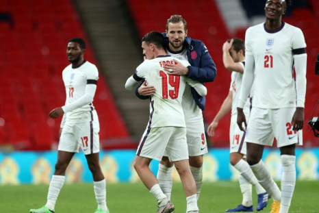 Phil Foden celebrates with Harry Kane after netting twice in England's big win over Iceland
