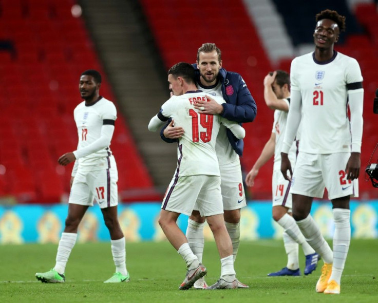 Phil Foden celebrates with Harry Kane after netting twice in England's big win over Iceland