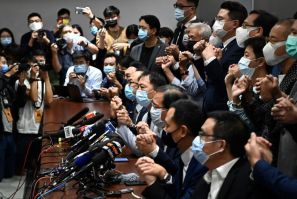 Pro-democracy Hong Kong lawmakers tell a news conference on November 11, 2020 that they will resign in solidarity with four colleagues disqualified by the city's pro-Beijing authorities