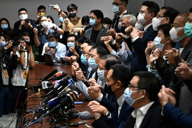 Pro-democracy Hong Kong lawmakers tell a news conference on November 11, 2020 that they will resign in solidarity with four colleagues disqualified by the city's pro-Beijing authorities