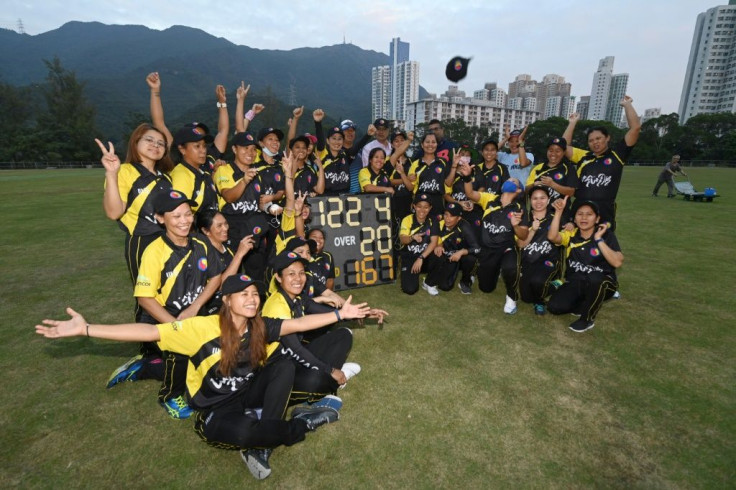 The SCC Divas Cricket Team, made up of domestic helpers from the Philippines, celebrate their lastest win against the Hong Kong Cricket Club Cavaliers