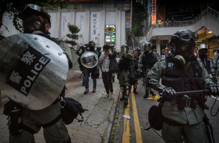 A Hong Kong judge says police were wrong to hide their ID badges during last year's protests