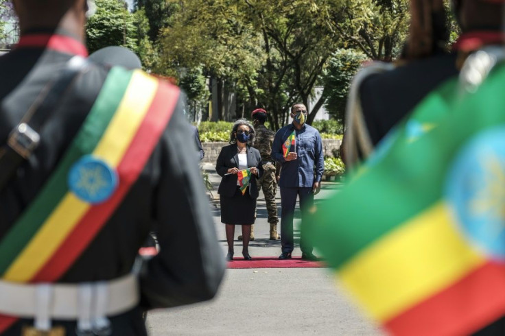 Prime Minister Abiy Ahmed, right, standing next to President Sahle-Work Zewde at ceremonies in Addis on Tuesday in honour of the armed forces