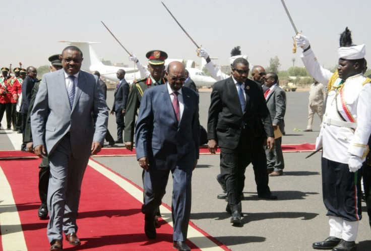 Red carpet: Former prime minister Halemariam Desalegn, left, on a visit to Khartoum in 2015 alongside Sudan's now-ousted leader, Omar al-Bashir
