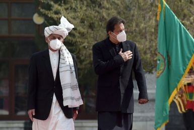 Prime Minister Imran Khan (R, with Afghan President Ashraf Ghani) said Pakistan would do 'whatever is possible' to help reduce violence in Afghanistan