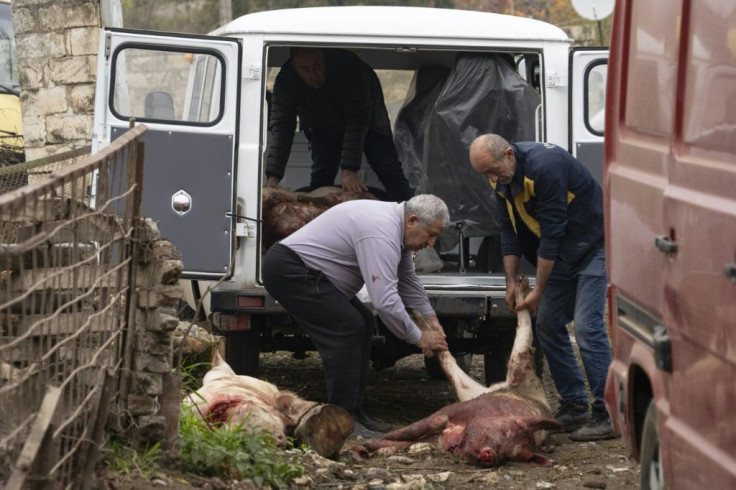 Some slaughtered pigs to take away with them