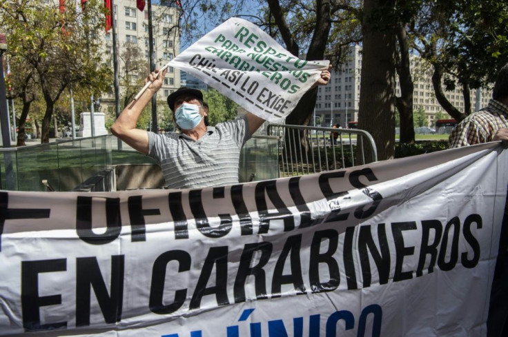 Retired officers calling for the resignation of Chile's police chief during an October 2020 protest outside the Carabineros headquarters in Santiago