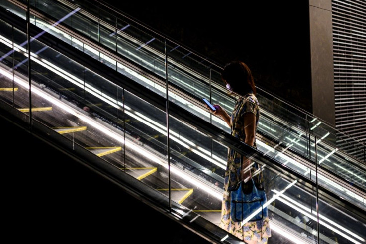 A woman wears a face mask at Tokyo shopping mall in June 2020