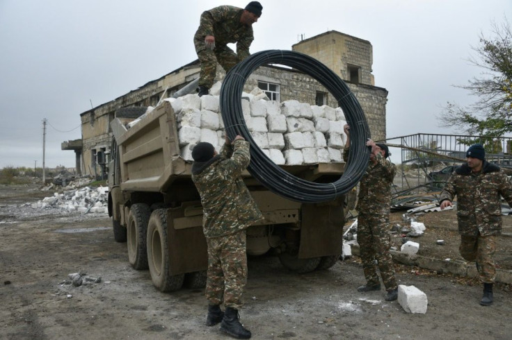 Armenian soldiers and residents were pulling out of Aghdam district before a deadline as part of a peace deal