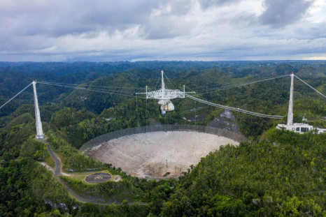 An aerial view of the Arecibo Observatory in Arecibo, Puerto Rico on November 19, 2020. The famed telescope will be decommissioned because the rupture of support cables have made it dangerous