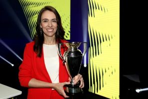 New Zealand Prime Minister Jacinda Ardern poses with the Women's Rugby World Cup during the 2021 draw event in Auckland