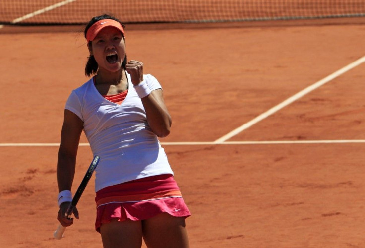 Li Na of China reacts during her semi-final match against Maria Sharapova of Russia at the French Open tennis tournament at the Roland Garros stadium in Paris