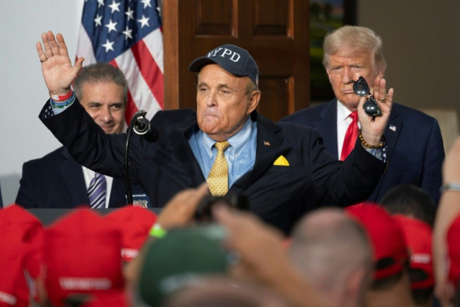 Giuliani, shown with President Donald Trump at his golf club in Bedminster, New Jersey on August 14, 2020 is said to have seen his relationship with the reality-star-turned-leader-of-the-free-world as a ticket to power