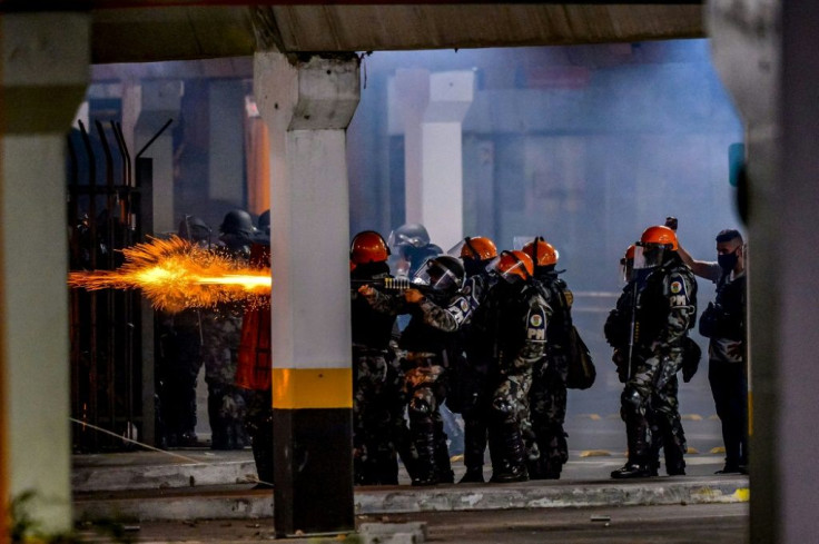 Brazilian police clash with demonstrators outside the Carrefour supermaket where a black man was beaten to death by security guards, in Porto Alegre, Rio Grande do Sul, Brazil, on November 20, 2020