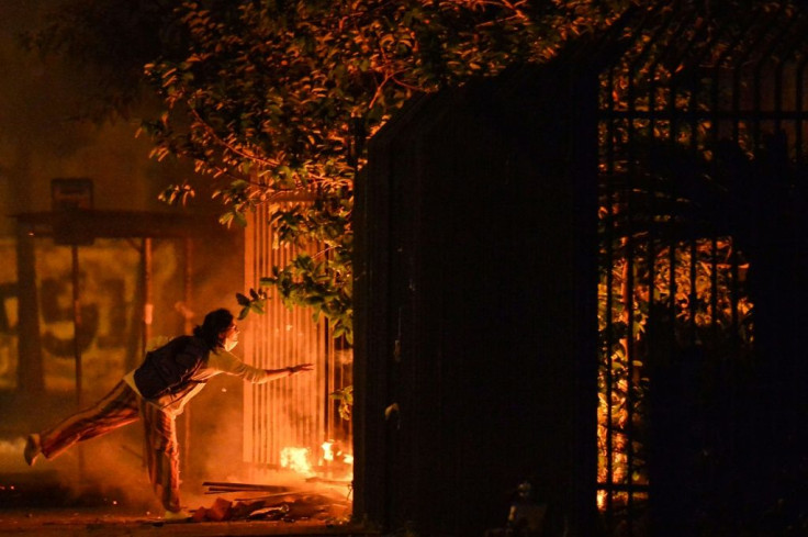 Demonstrators start a fire at the entrance of the Carrefour supermaket where a black man was beaten to death by security guards on Brazil's Black Consciousness day, in Porto Alegre, Rio Grande do Sul, Brazil, on November 20, 2020