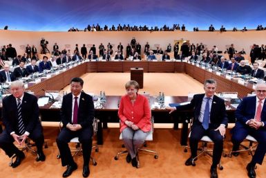 Many liberals around the world may still hail the brainy, pragmatic and unflappable Merkel as a welcome counter-balance to the big, brash men of global politics