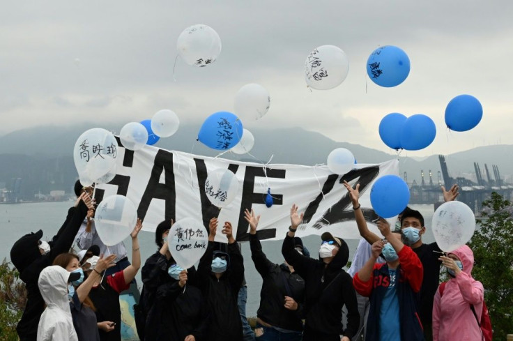 Relatives and some supporters released balloons carrying messages to their loved ones