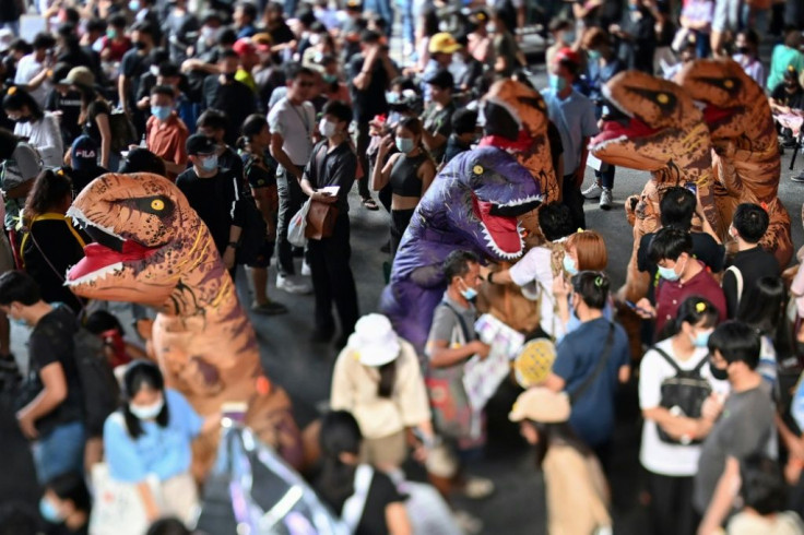 Thai protestors dressed as dinosaurs rally with students for reform of the education system