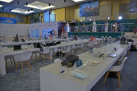 Journalists work in an almost empty media room set up for the coverage of the G20 summit,  held virtually due to the  coronavirus pandemic, in the Saudi capital Riyadh, on November 20, 2020