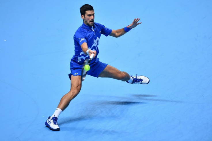 Novak Djokovic in action against Dominic Thiem in the last four of the ATP Finals
