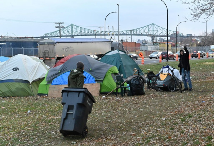 A homeless camp, set up in the summer of 2020 due to the coronavirus pandemic, lines a busy Montreal boulevard