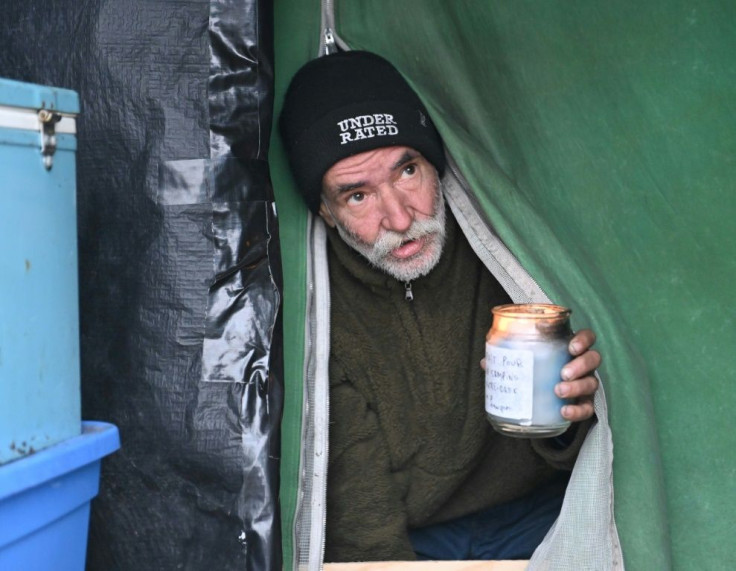 Homeless camp resident Jacques Brochu exits his tent at a Montreal encampment set up in the summer of 2020