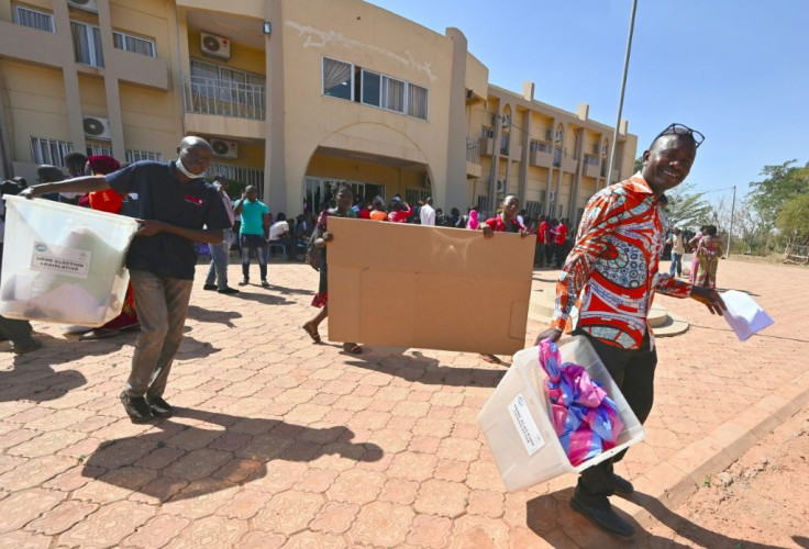 Election workers heading for a polling station in  Ouagadougou on Saturday to set up the ballot boxes