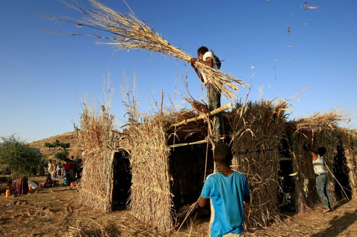 Ethiopian refugees build a house in the Um Raquba camp in Sudan, some of the more than 36,000 Ethiopians who have fled fighting in the northern Tigray region