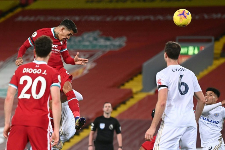 Rising high: Roberto Firmino (top left) rounded off the scoring in a 3-0 win over Leicester as Liverpool moved joint top of the Premier League