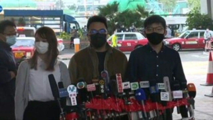Prominent democracy dissident Joshua Wong announces he and two other leading activists will plead guilty at the opening of a trial over their involvement in last year's protests.