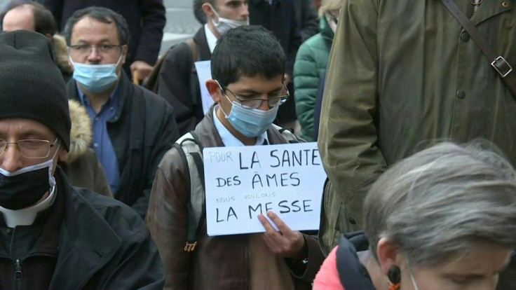 Dozens of Catholics gather to pray in front of the Saint-Augustin church in Paris, kneeling on the ground, to demand the immediate return of Mass. Mass and other religious ceremonies are prohibited under France's second confinement against coronavirus.