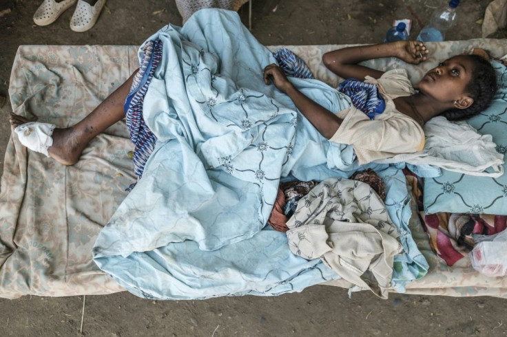 A girl recovers from her wounds at her house in Humera