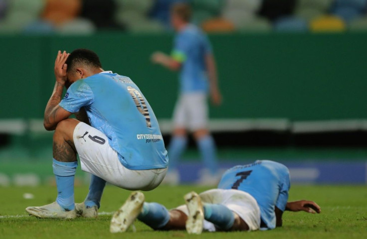 Manchester City's Gabriel Jesus (left) and Raheem Sterling (right) react to losing to Lyon in last season's Champions League quarter-finals