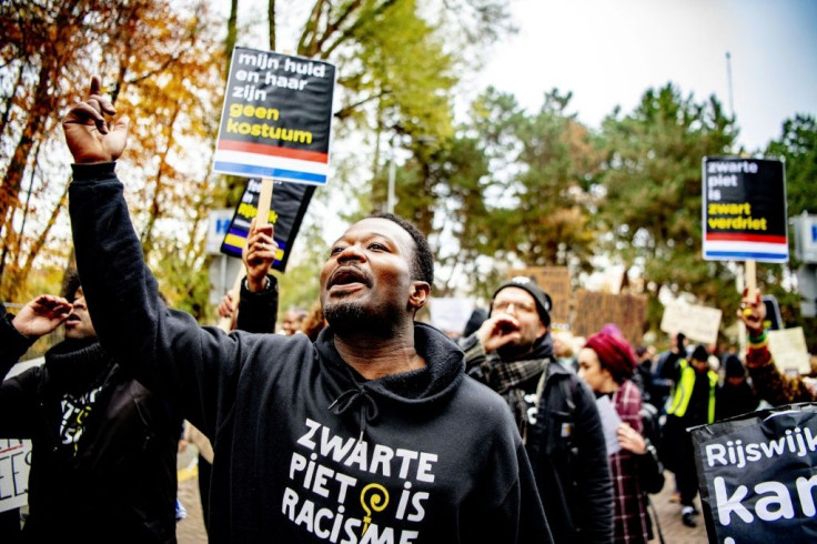 Poet and anti-racism activist Jerry Afriyie (centre) has been threatened and attacked for his campaigning