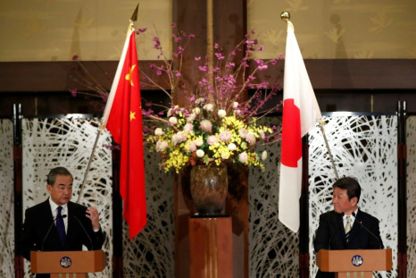 China's State Councillor and Foreign Minister Wang Yi (left) and his Japanese counterpart Toshimitsu Motegi held talks in Tokyo