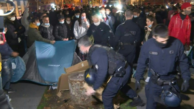 Police dismantle a new migrant camp in the centre of Paris set up to house hundreds of refugees evacuated from makeshift suburban shelters without being relocated