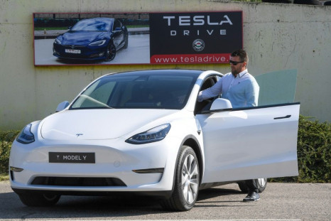 A driver prepares to test drive a Tesla on September 5, 2020, during a presentation at the Automobile Club of Budapest