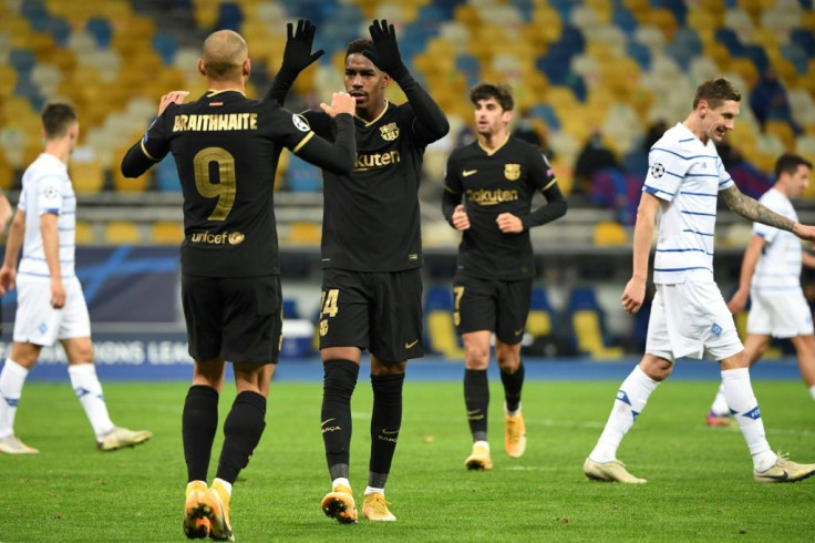 Martin Braithwaite celebrates with Junior Firpo after scoring as Barcelona beat Dynamo Kiev 4-0 to qualify for the last 16 of the Champions League