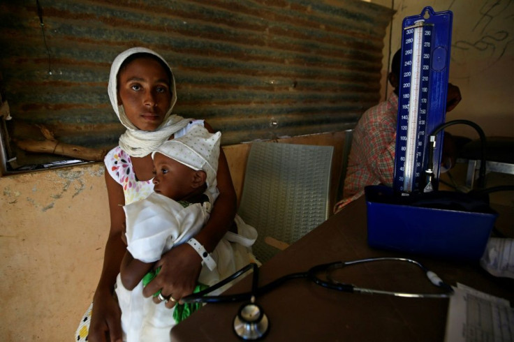 Ethiopian refugees who fled fighting in Tigray receive medical care at the Um Raquba camp in eastern Sudan