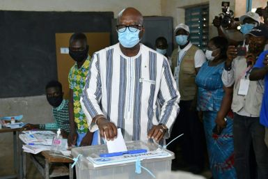 Ahead: President Roch Marc Christian Kabore, seen casting his vote in the capital Ouagadougou on Sunday