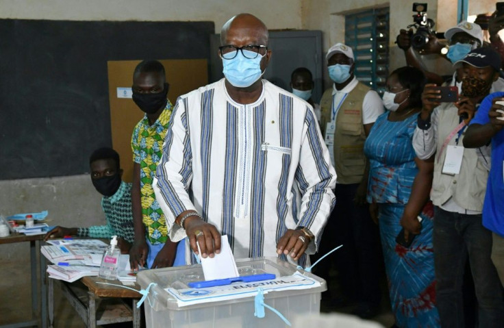Ahead: President Roch Marc Christian Kabore, seen casting his vote in the capital Ouagadougou on Sunday