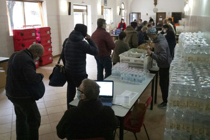 Priest Mauro Battaglino of the Order of Friars Minor said more than 400 people were lining up each day at his premises