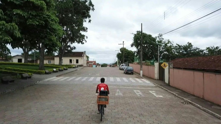 Flavio Rafael makes a living doing an unusual job -- he bikes through the streets of Cedro do AbaetÃ© twice a day with a speaker reminding locals to wear face masks and respect measures against Covid-19 in the only Brazilian municipality where not a singl